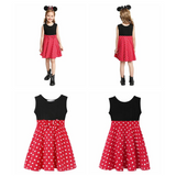 "Girls' red sleeveless dress with white polka dots, black bodice, and decorative bow at the waist front and back view with model