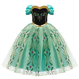 Front view of a child's Anna-inspired princess costume with a black velvet bodice, gold trim, and a green tulle skirt with floral accents