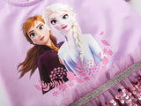 close up bodice view of A Frozen-themed children's dress featuring a pastel pink top with printed images of Anna and Elsa and a vibrant purple sequined skirt, perfect for a playful princess look.