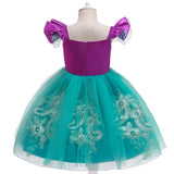 back view Little Mermaid-inspired special occasion dress for girls in purple and teal with seashell details, flowing tulle skirt, and optional tiara and magic wand accessories. Perfect for birthdays, costume parties, and dress-up play.