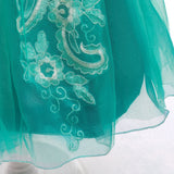 dress detail Little Mermaid-inspired special occasion dress for girls in purple and teal with seashell details, flowing tulle skirt, and optional tiara and magic wand accessories. Perfect for birthdays, costume parties, and dress-up play.